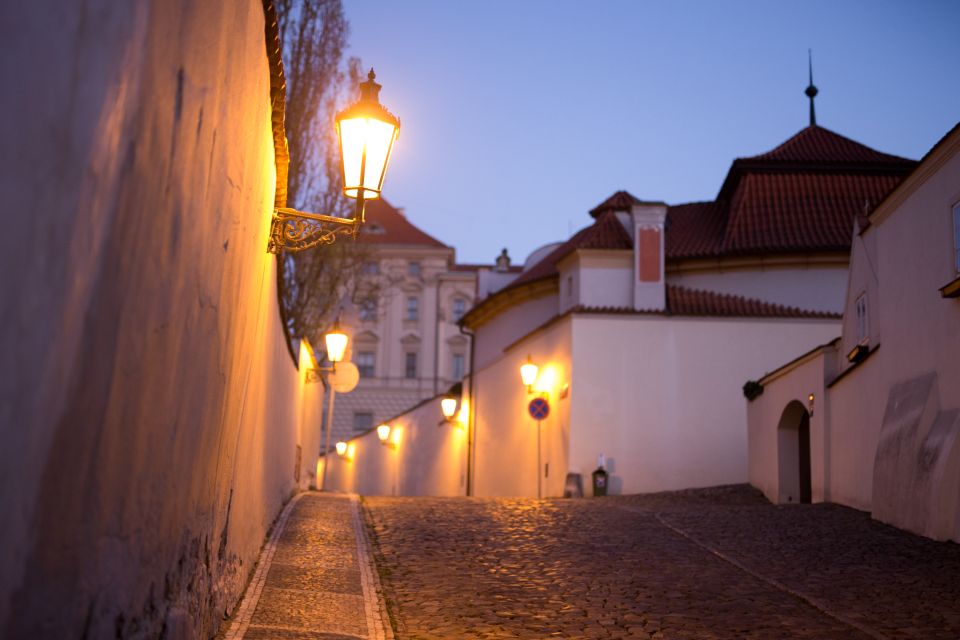 Alchemy and Mysteries of Prague Castle Walking Tour - Reaching Prague Castle: courtyards, St. Vitus spires, and the front gate