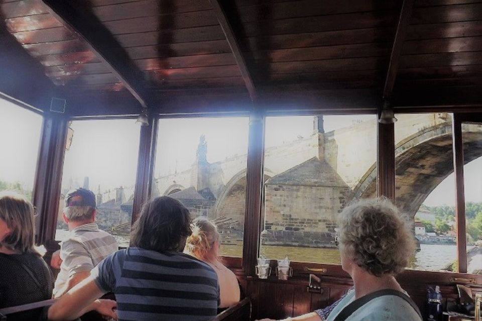 Prague: 6-Hour Tour with River Boat Cruise and Lunch - Entering Old Town Square with legends that make the city click