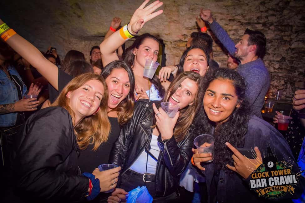 Prague: Clock Tower Bar Crawl with Drinks and Shots - Stop One: Where the Unlimited Drinks and Games Kick In